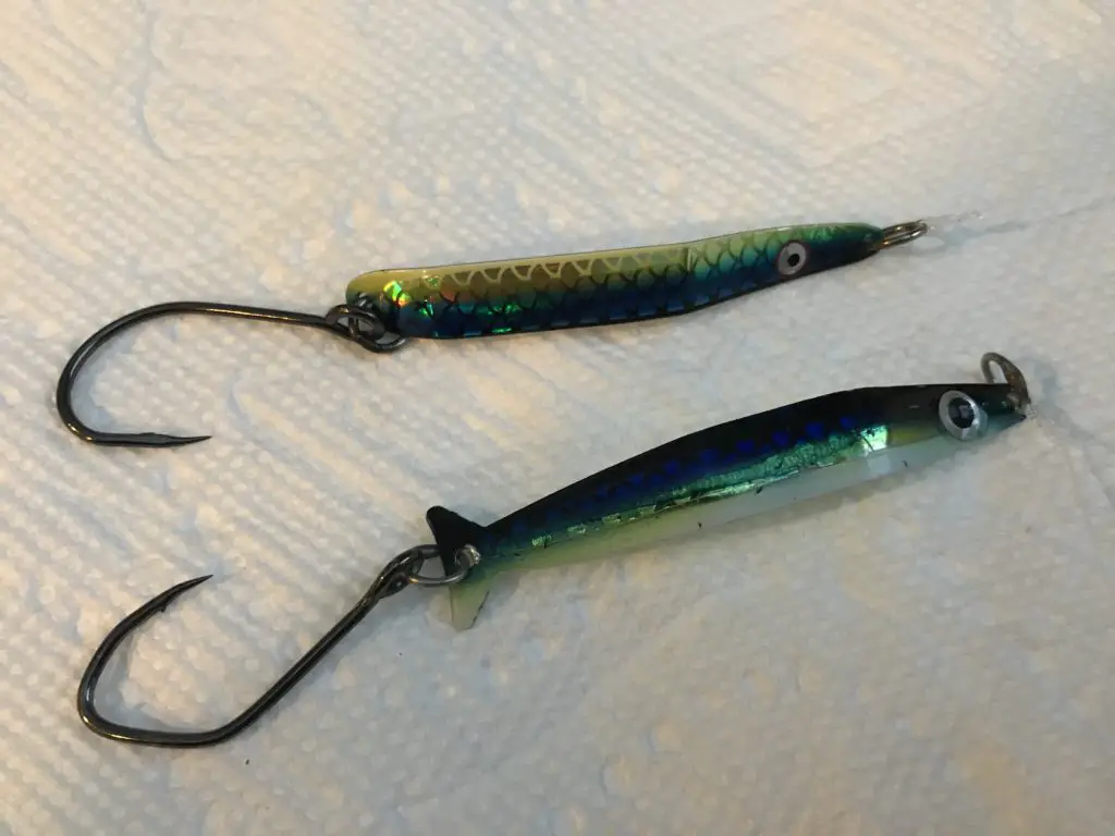 Two popular trolling spoons in herring aide color