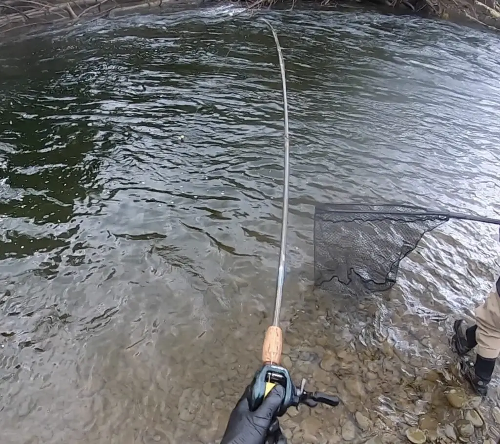 Thumbing the spool leading to the net