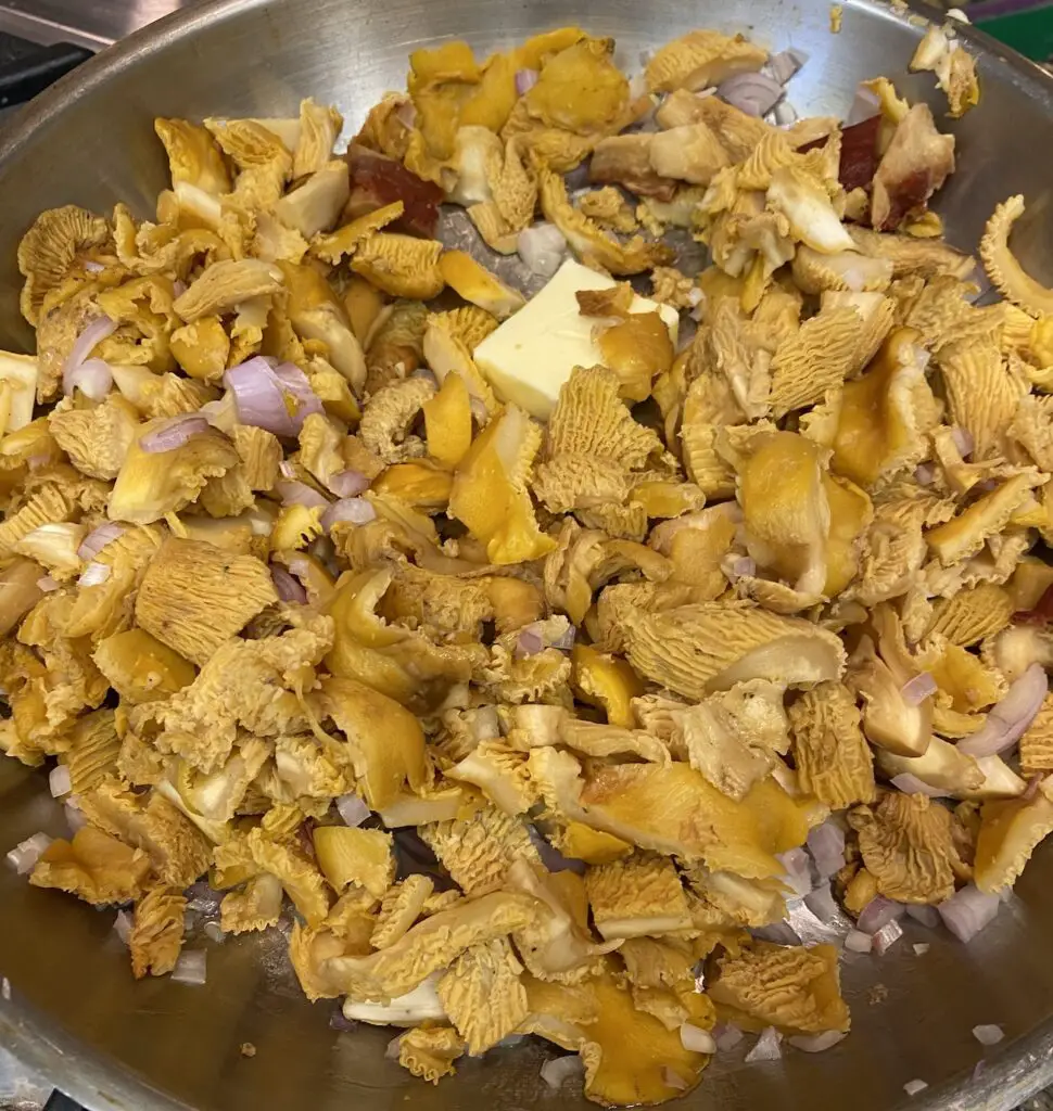 chanterelles cooking with butter and onion