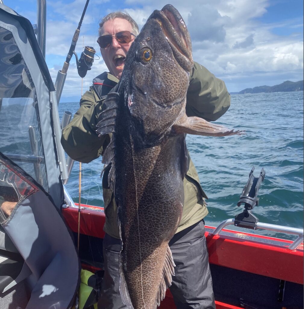 Ash posing with 38 lb lingcod