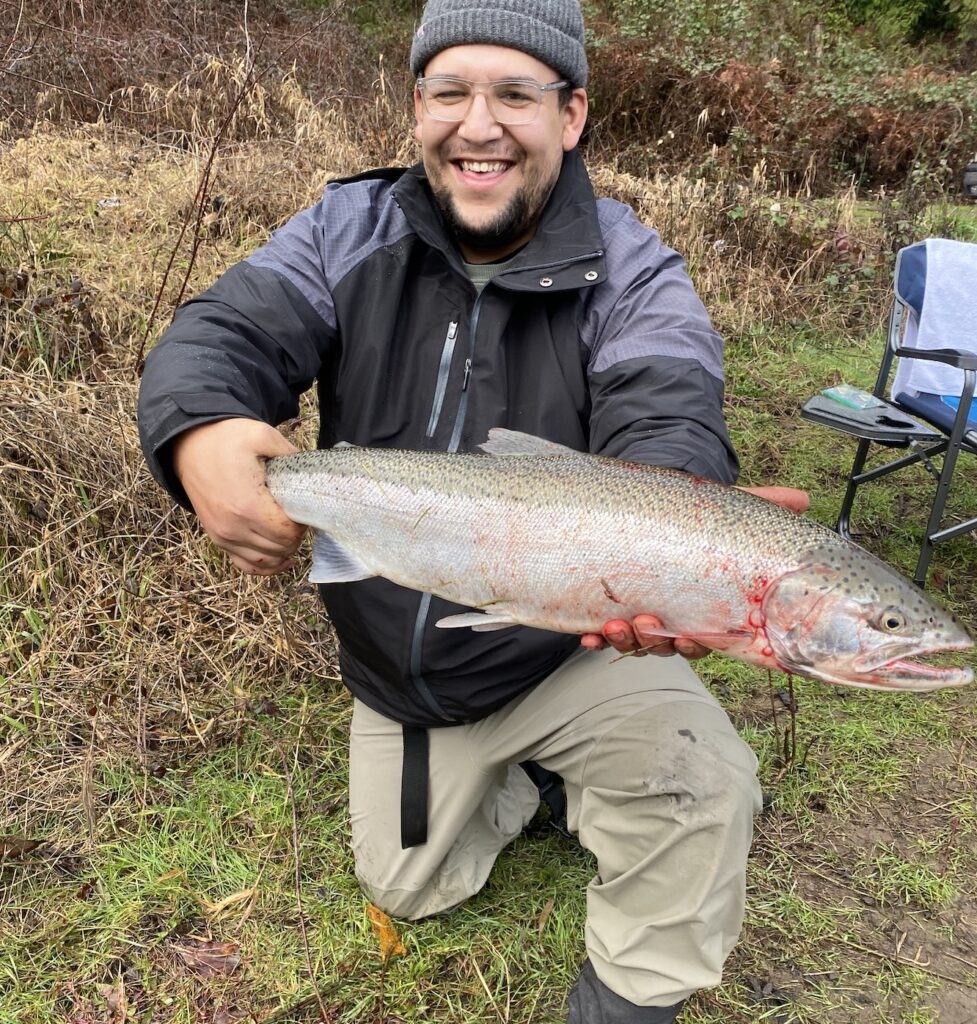 Daniel holding a winter steelhead caught in SW Washington